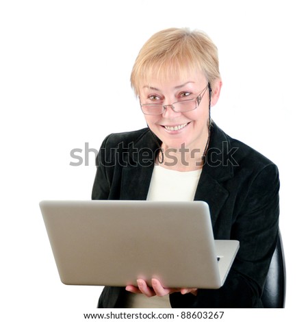 business woman in a black suit and glasses with a laptop isolated on white background
