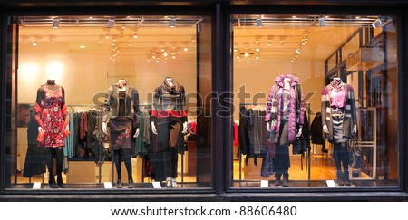 Boutique window with dressed mannequins Royalty-Free Stock Photo #88606480