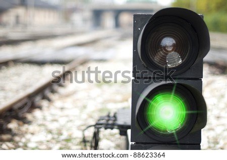 Traffic light shows green signal on railway. Green light