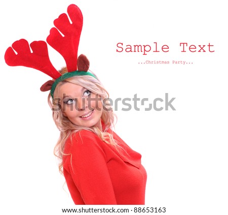 Happy young woman with reindeer attire on a christmas party. Picture with space for your text.