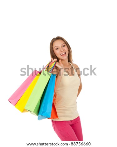attractive excited smile teenage shopping girl hold colorful bags, isolated over white background