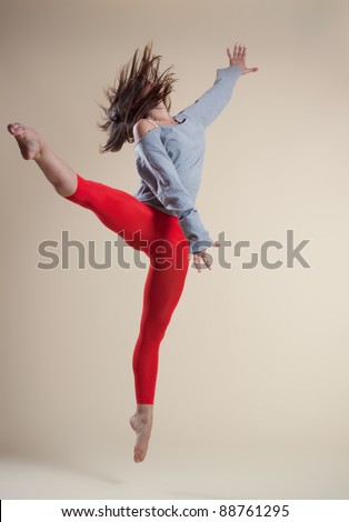 modern ballet dancer dancing on the white studio background
