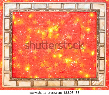 Festive image of a picture frame on red background