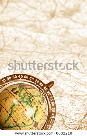 old globe on background of map Royalty-Free Stock Photo #8882218