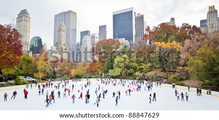 Ice skaters having fun in New York Central Park in fall Royalty-Free Stock Photo #88847629