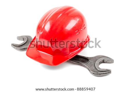 photo  beauty red  safety cap and steel  wrench, close up on white background, full face