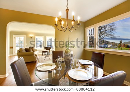 Green interior with dining room with living room