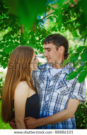 Beautiful young couple relaxing in park