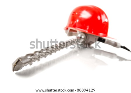 photo  beauty red  safety cap and perforator with  stone-drill, close up on white background, isolated