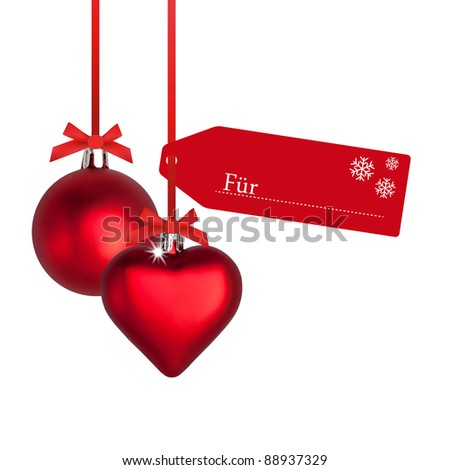 Christmas heart hanging on reds ribbons with tag