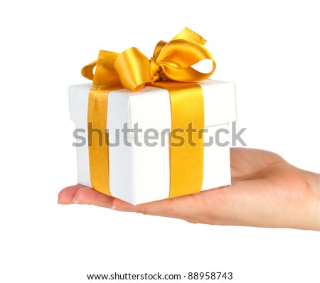 gift box with gold ribbon in hand isolated on white