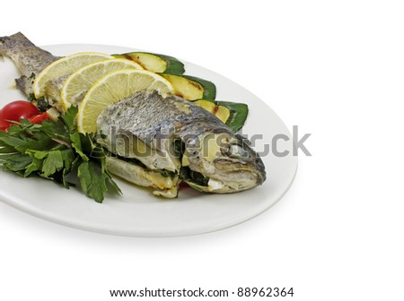 Photo of fish with vegetables on a plate
