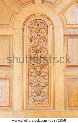 Floral motifs carved on the old wooden doors.