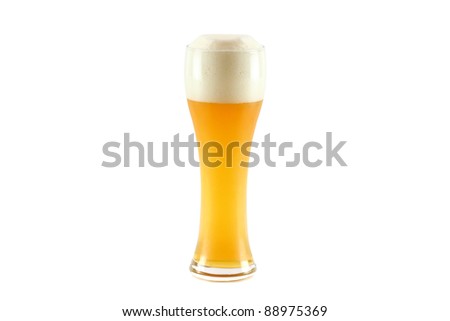 A glass of cold Bavarian wheat beer with thick foam bubble isolated on white background