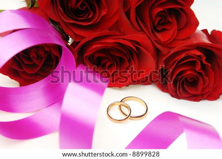 Wedding decoration including roses and golden rings