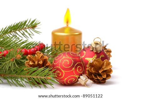 Christmas balls with gold candle over white