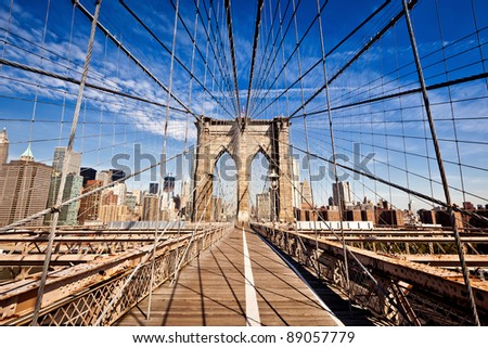 New York City Brooklyn Bridge in Manhattan closeup with skyscrapers and city skyline over Hudson River. Royalty-Free Stock Photo #89057779