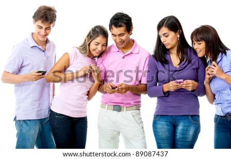 Group of young people texting on their cell phones - isolated over a white background