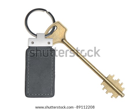 Key with leather trinket. It is isolated on a white background