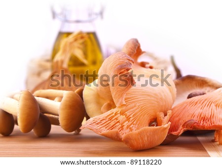 Stock Photo: Fresh mushrooms on a wooden board