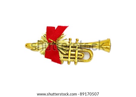 Golden christmas trumpet  and red ribbon on a white background