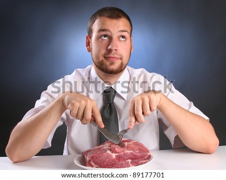 eccentric guy eating red meat Royalty-Free Stock Photo #89177701