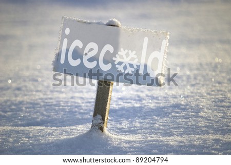 Signboard with text ice cold, in the winter scene