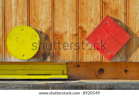 Facade of a bee house with colorful symbols