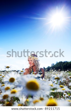  beautiful girl  in dress on the sunny daisy flowers field