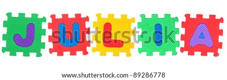 The name JULIA made of letter puzzle, isolated on white background.