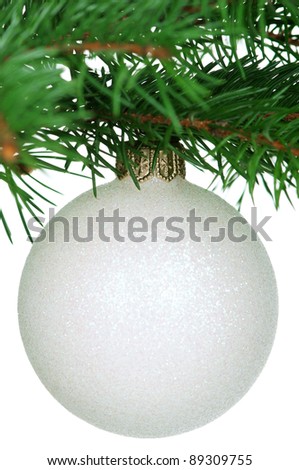 Small bauble on green christmas firtree on white background