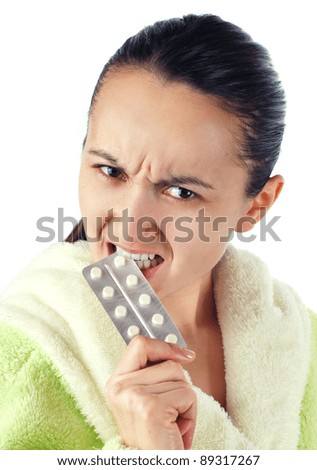 Young angry women bite drugs, isolated on white