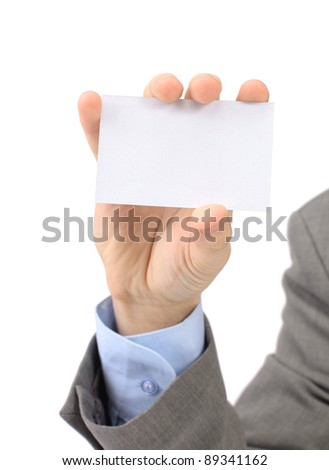 A businessman in a grey suit and a blue shirt shows, professional business card with a copy of the space, small-scale department of the field. Isolated on a white background.