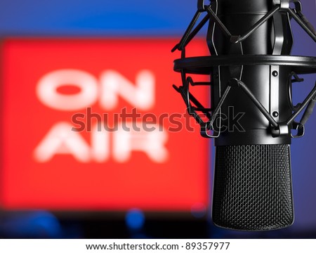 Microphone with blurred on  air sign in the background, for broadcasting,sound related themes Royalty-Free Stock Photo #89357977