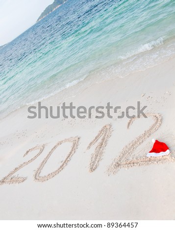 Numbers 2012 on tropical beach sand