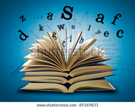The Magic Book and the letters on a dark background with formula. Education concept
