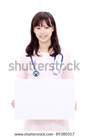 Young japanese female nurse holding a blank white board