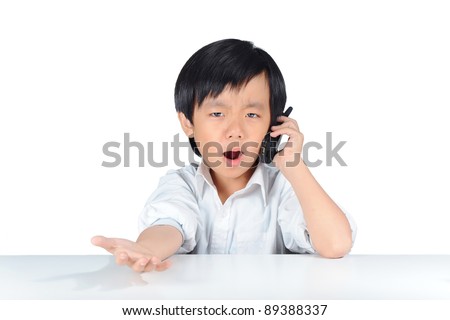 Asian boy resembling a young business man argumenting on the phone