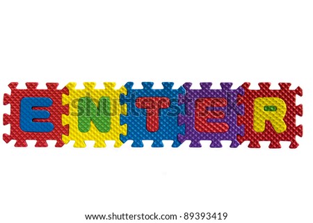 The word "Enter" written with alphabet puzzle letters isolated on white background