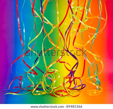 party decoration. streamer on colorful rainbow background