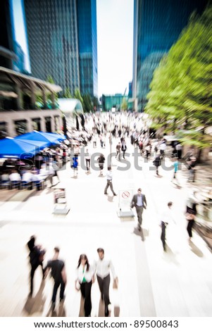 Zoom on business people rushing around at Canary Wharf, London. Motion blur. Royalty-Free Stock Photo #89500843
