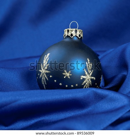 blue christmas ball on silk