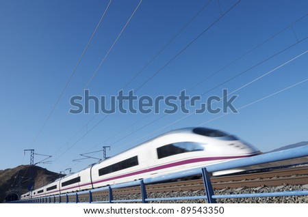view of a high-speed train crossing a viaduct in Purroy, Saragossa, Aragon, Spain; AVE Madrid Barcelona Royalty-Free Stock Photo #89543350