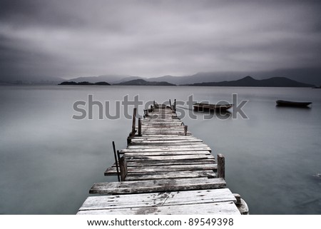 pier and boat, low saturation Royalty-Free Stock Photo #89549398