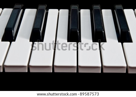 a piano keyboard isolated on a black background
