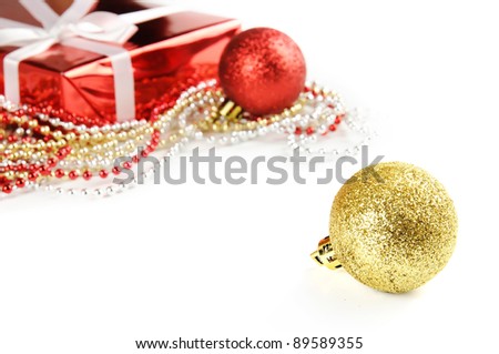 Christmas decoration with red gift box and shiny tinsel