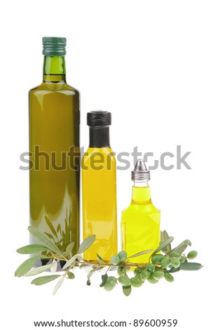 green raw olives with gold oil on white background
