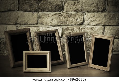 old photo frames on the wooden table