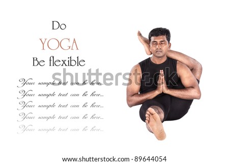 Yoga eka pada shirshasana foot behind the head pose by Indian man in black cloth isolated at white background. Free space for text and can be used as template for web-site