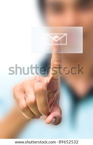 Man pushing email icon on touch screen pad